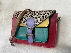 Handcrafted, recycled leather & suede bags.