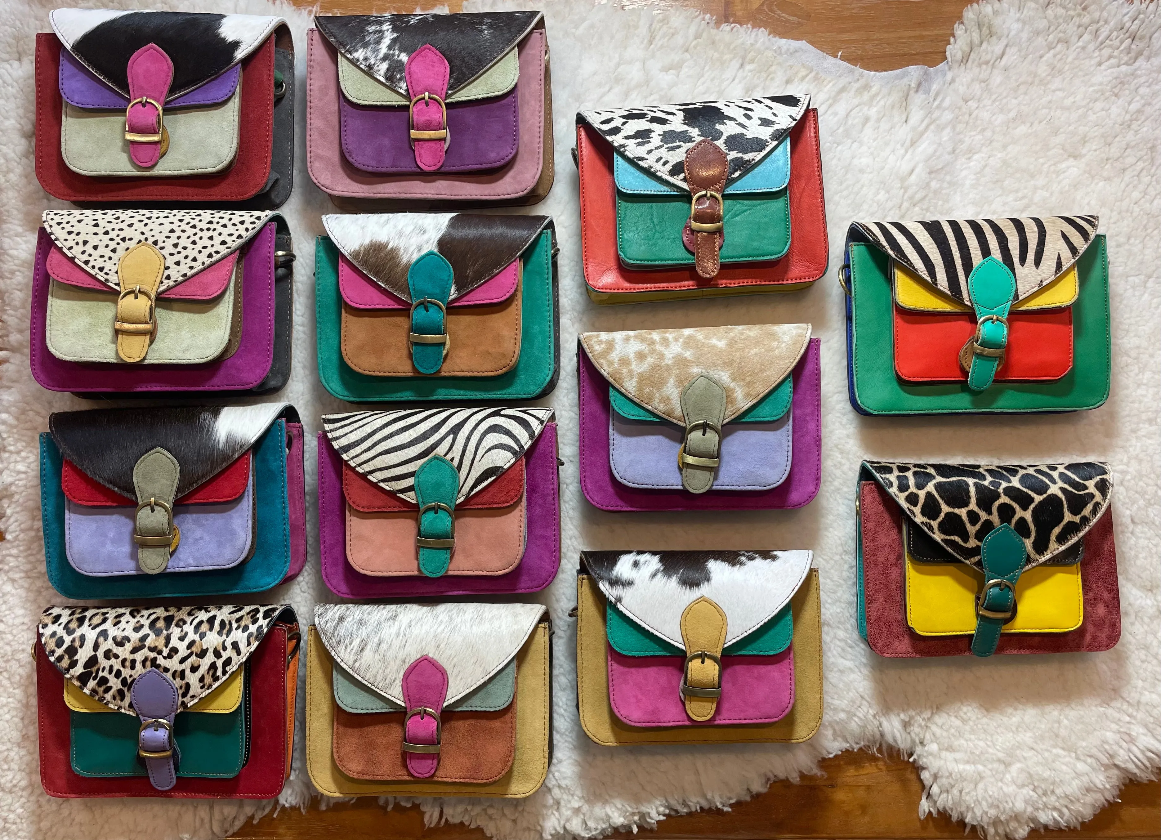 Handcrafted, recycled leather & suede bags.