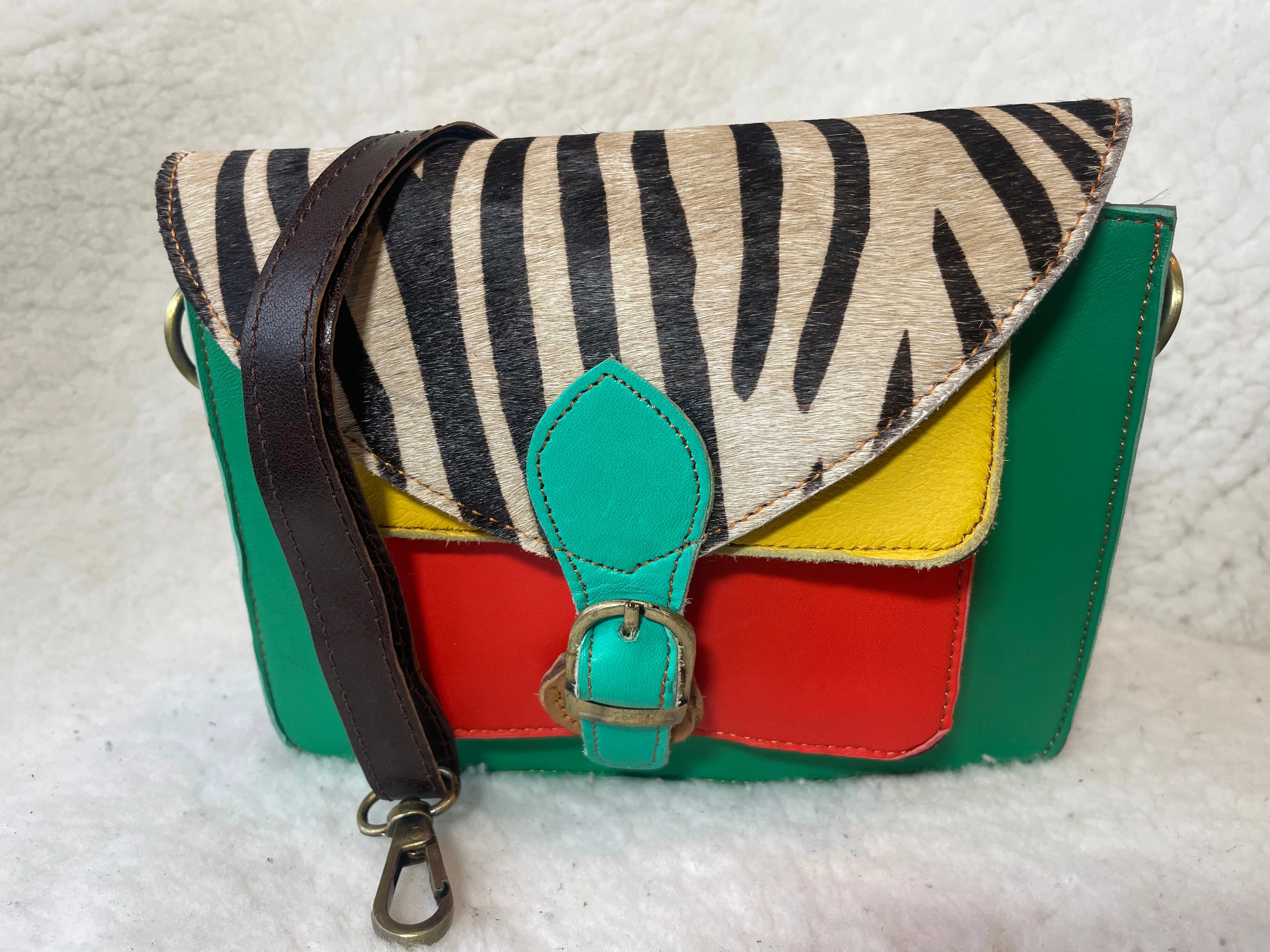 Handcrafted, recycled leather & suede bags.