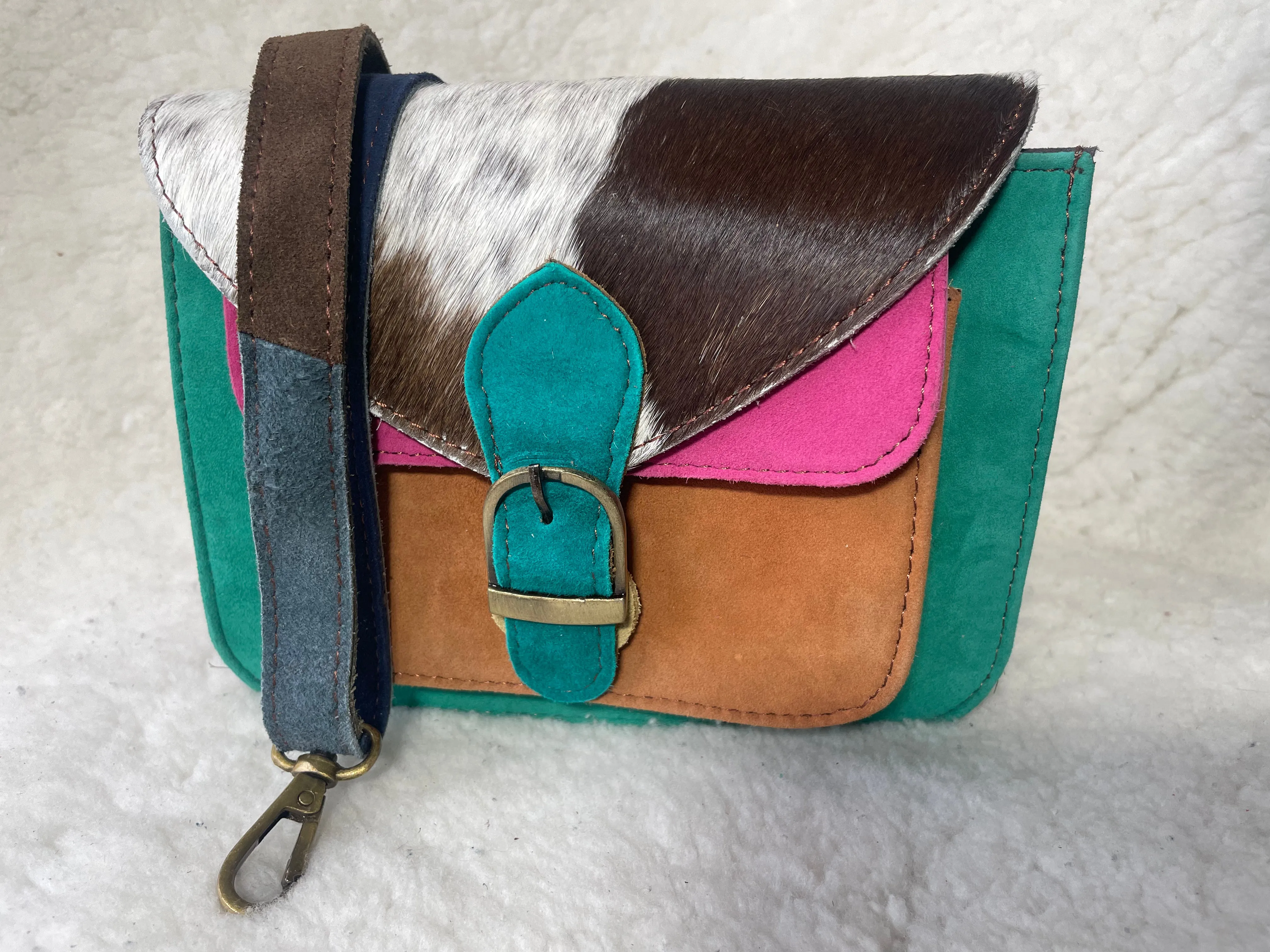 Handcrafted, recycled leather & suede bags.