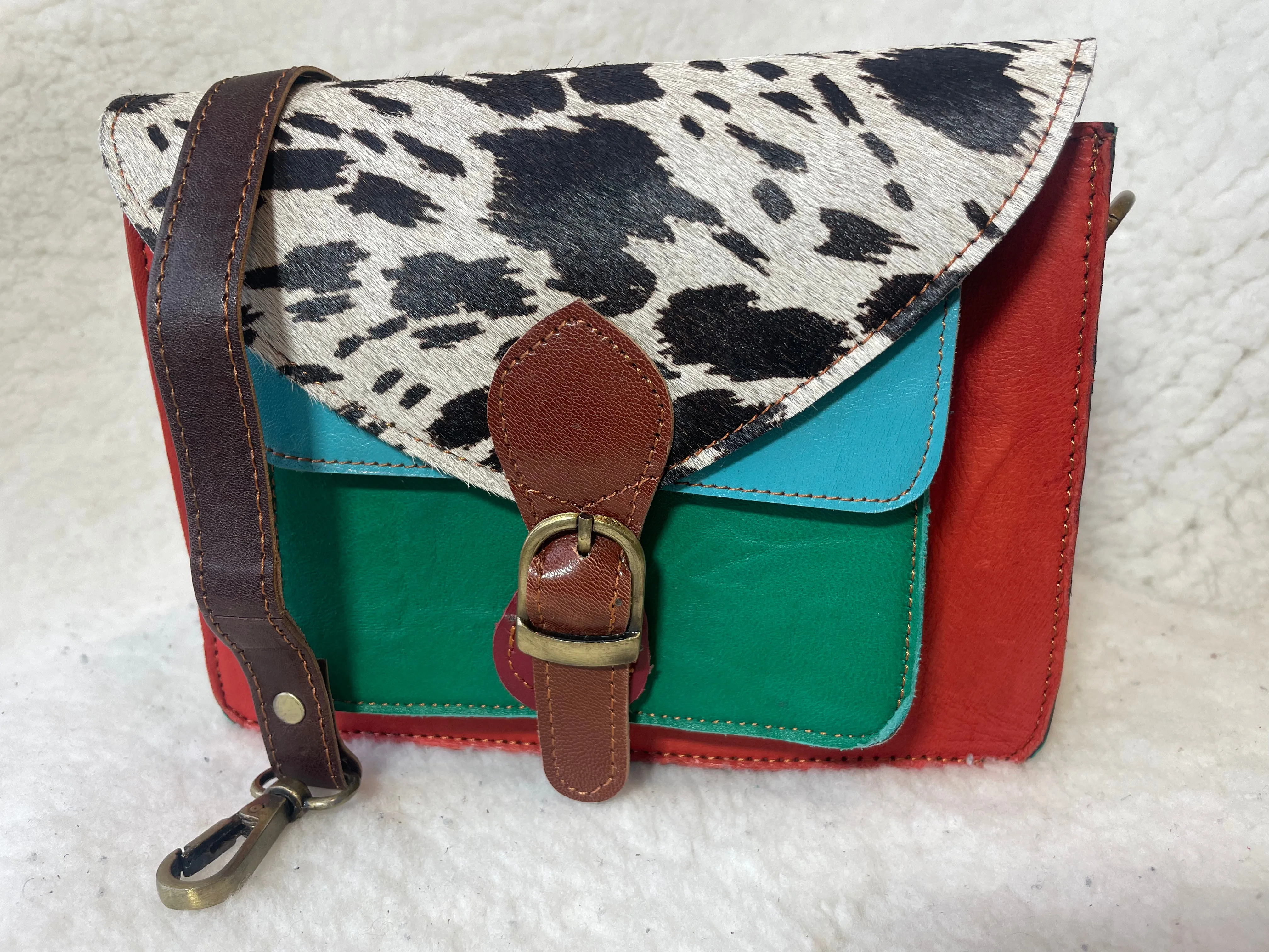 Handcrafted, recycled leather & suede bags.