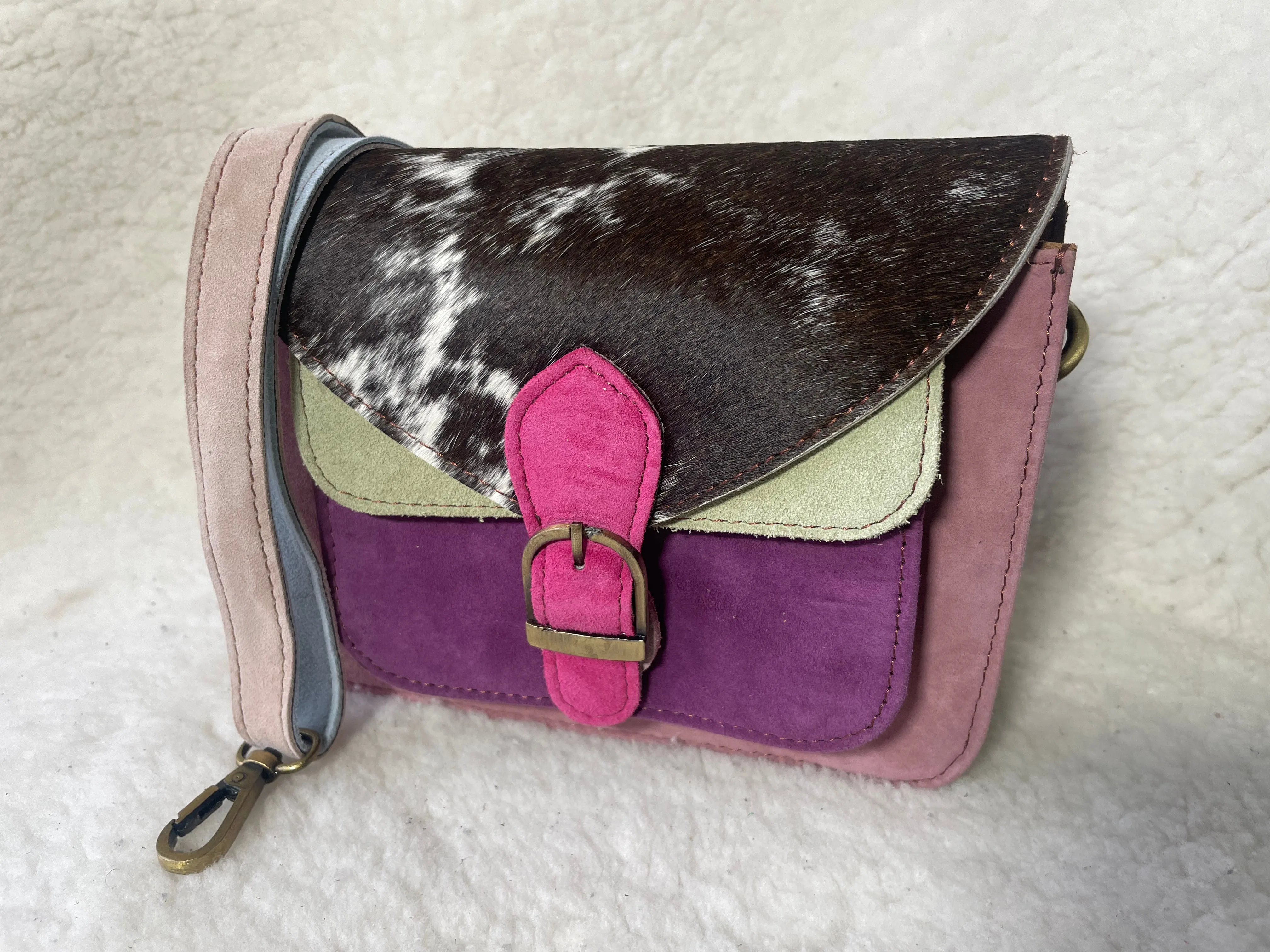 Handcrafted, recycled leather & suede bags.