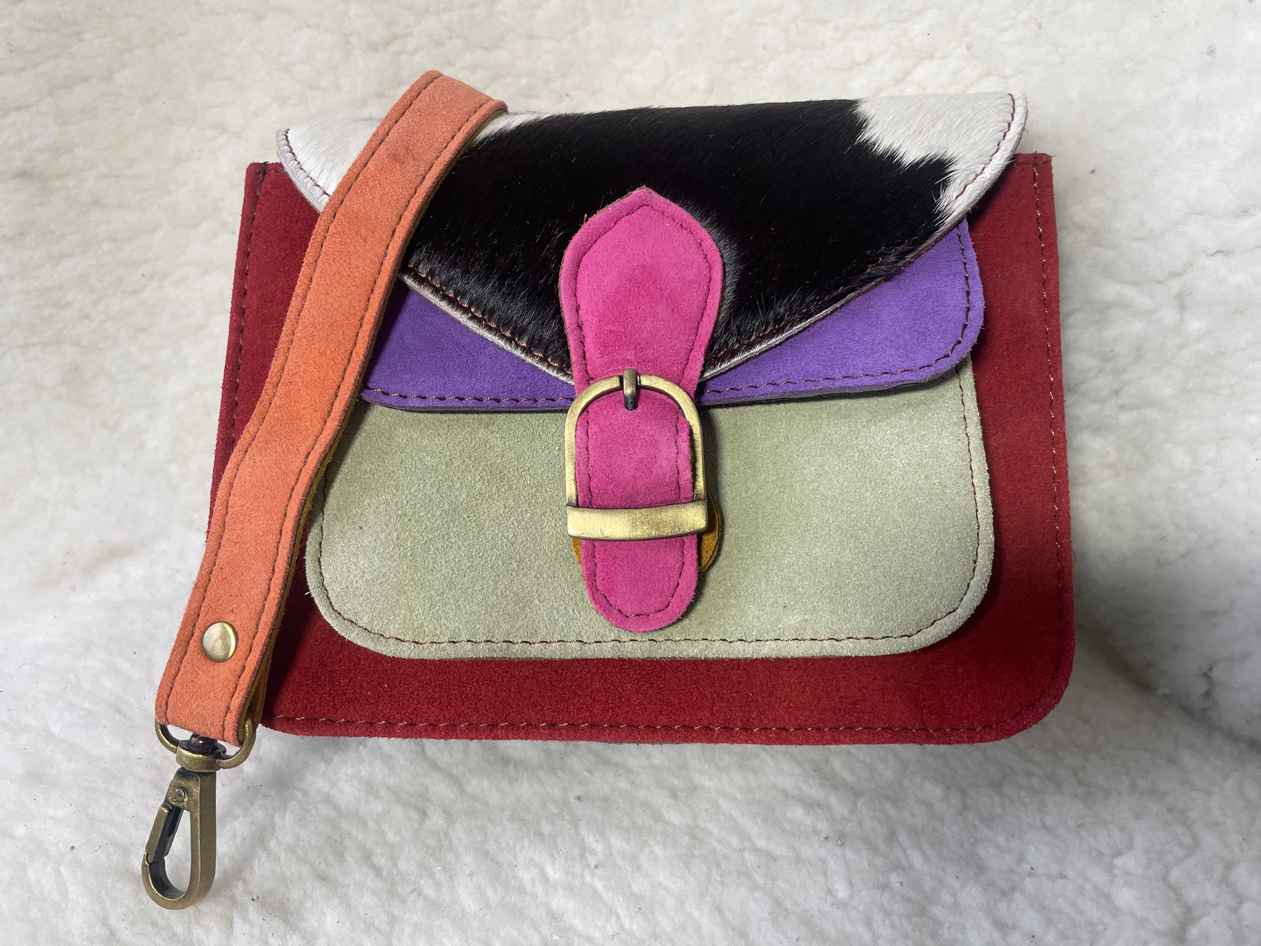 Handcrafted, recycled leather & suede bags.