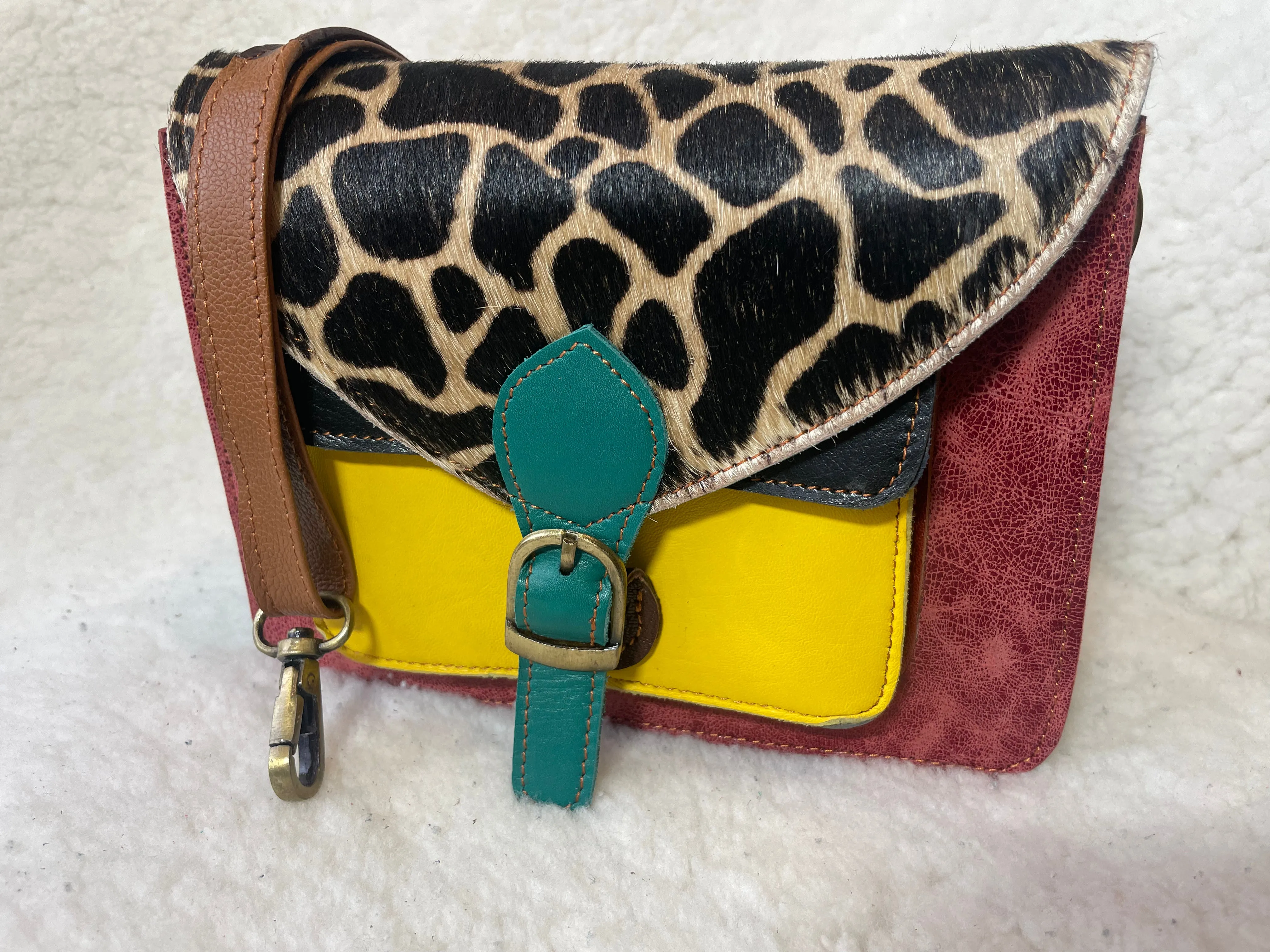 Handcrafted, recycled leather & suede bags.