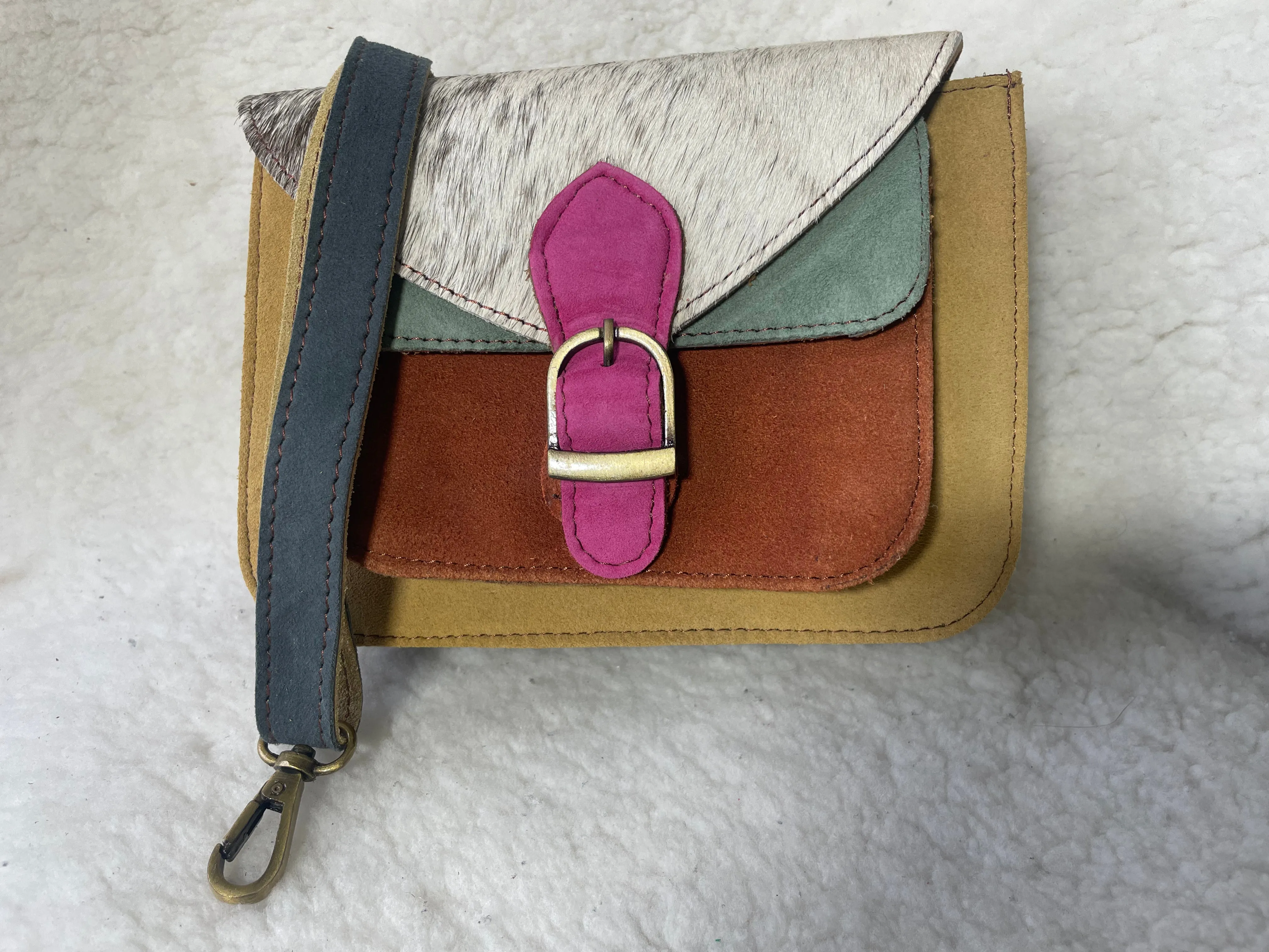 Handcrafted, recycled leather & suede bags.