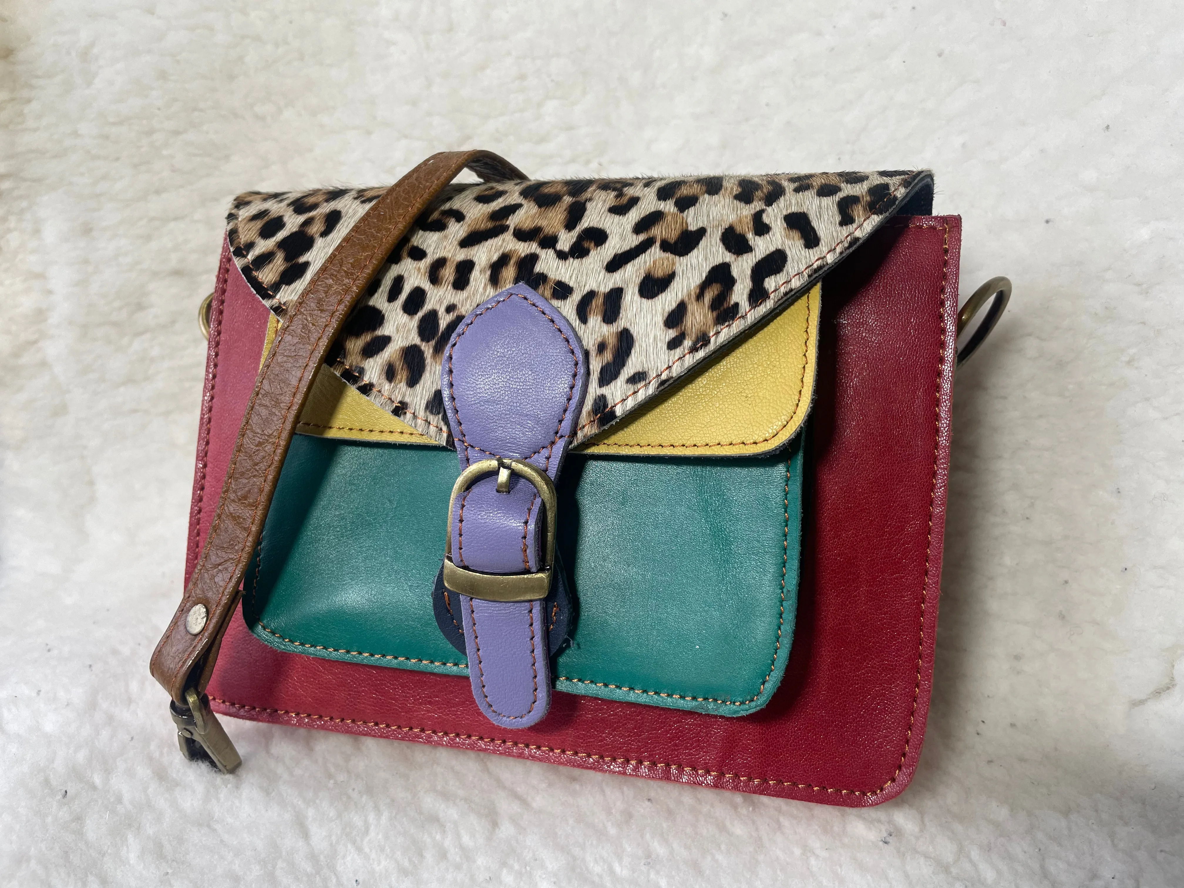Handcrafted, recycled leather & suede bags.