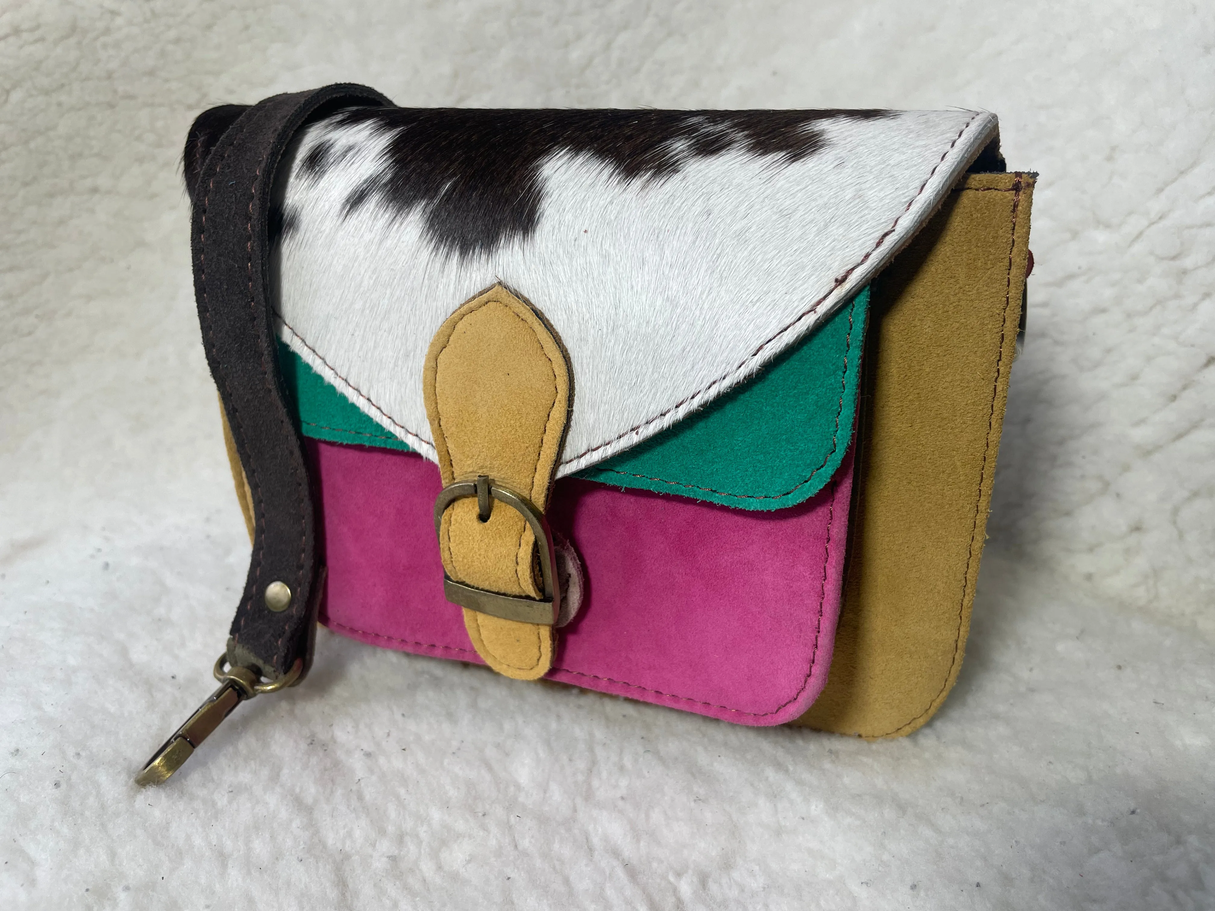 Handcrafted, recycled leather & suede bags.