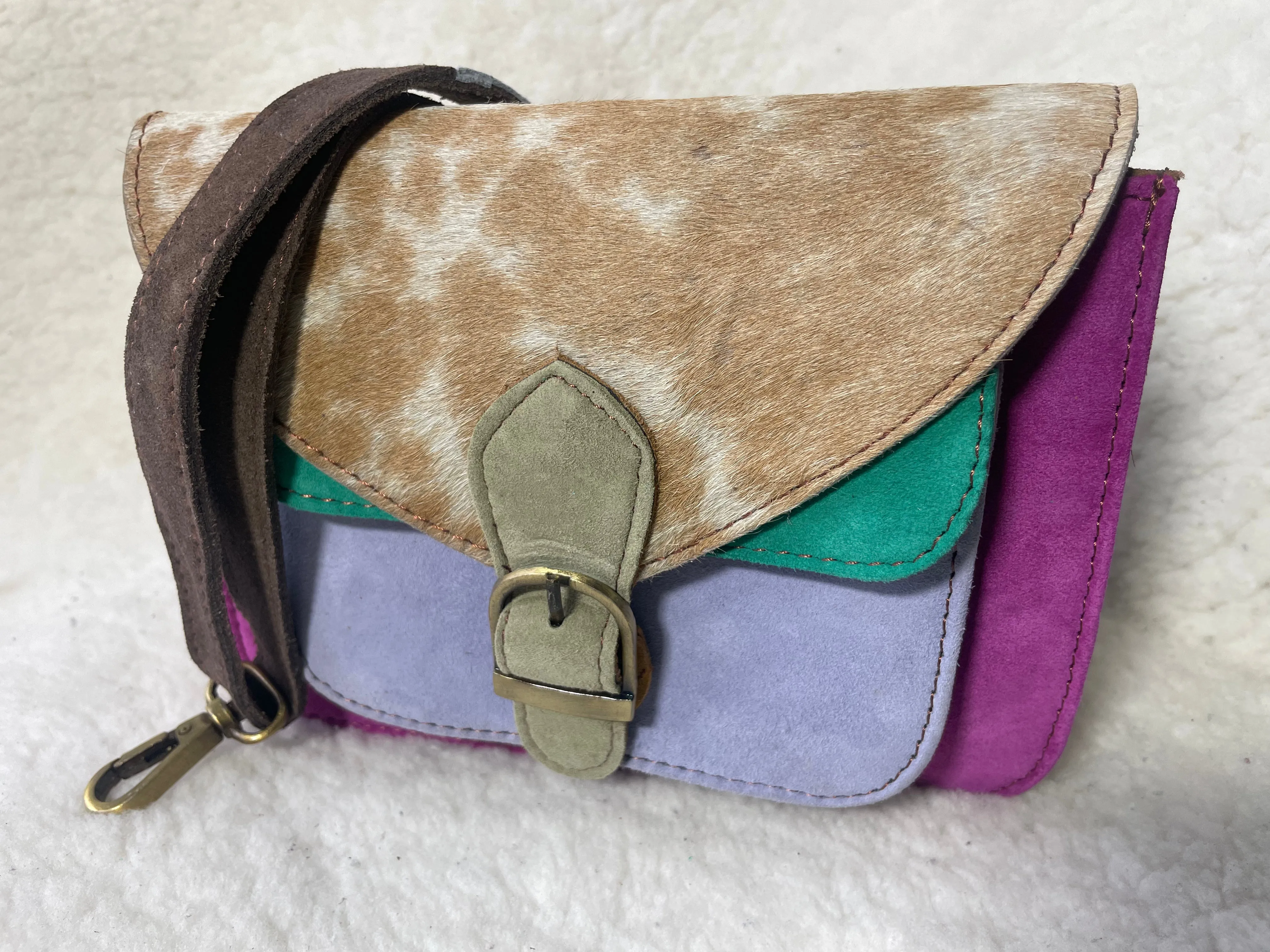 Handcrafted, recycled leather & suede bags.