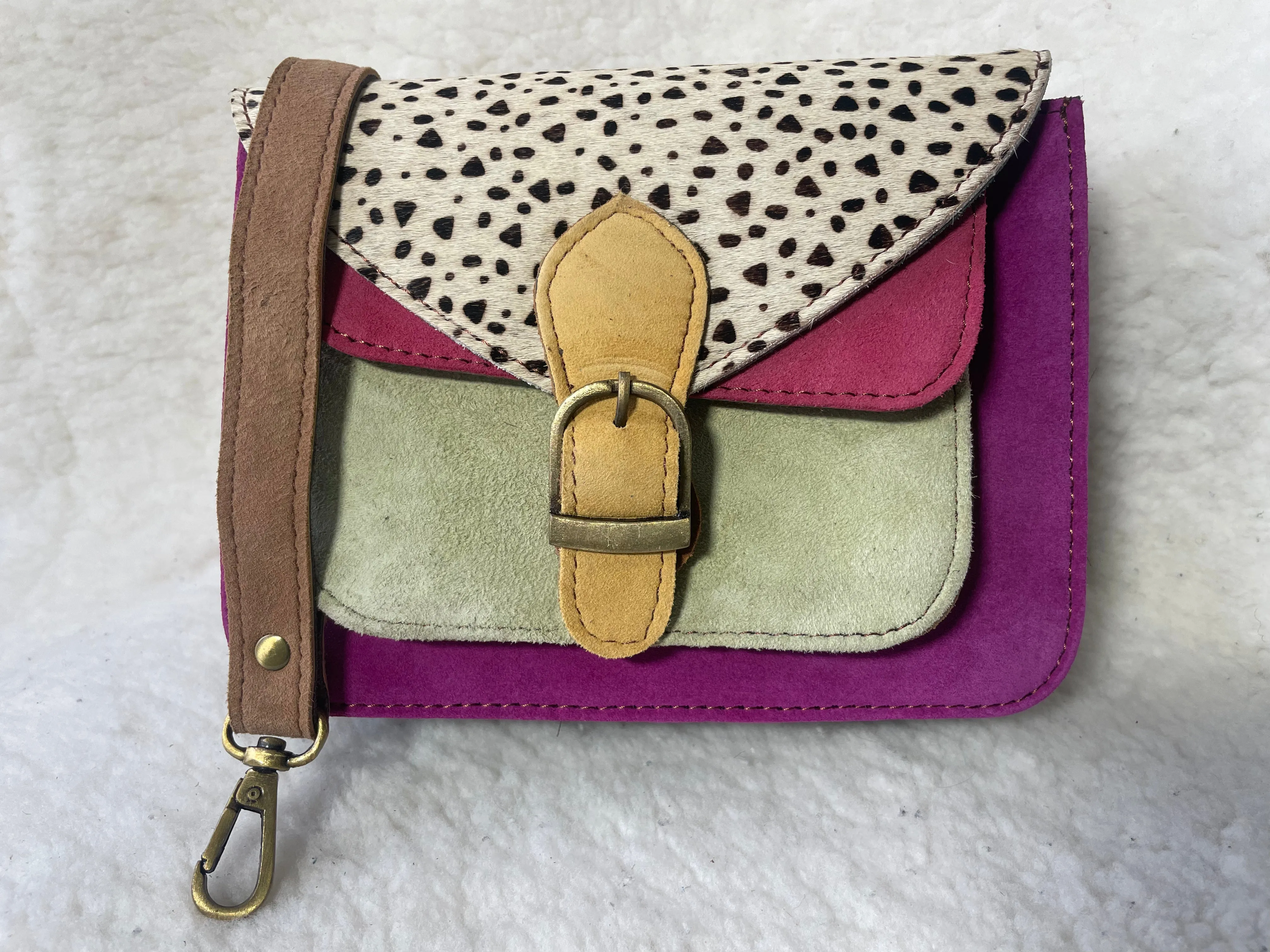 Handcrafted, recycled leather & suede bags.