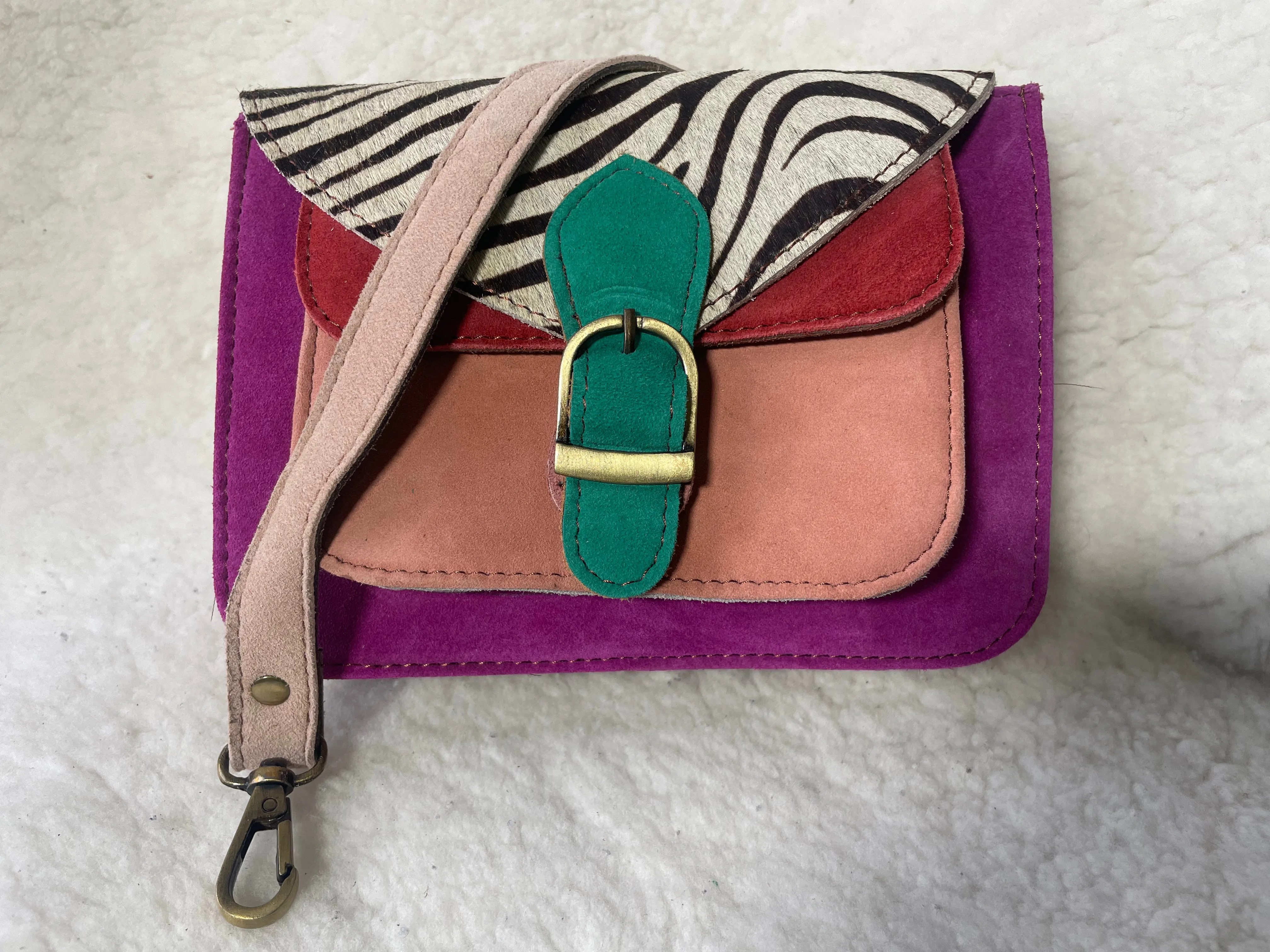 Handcrafted, recycled leather & suede bags.
