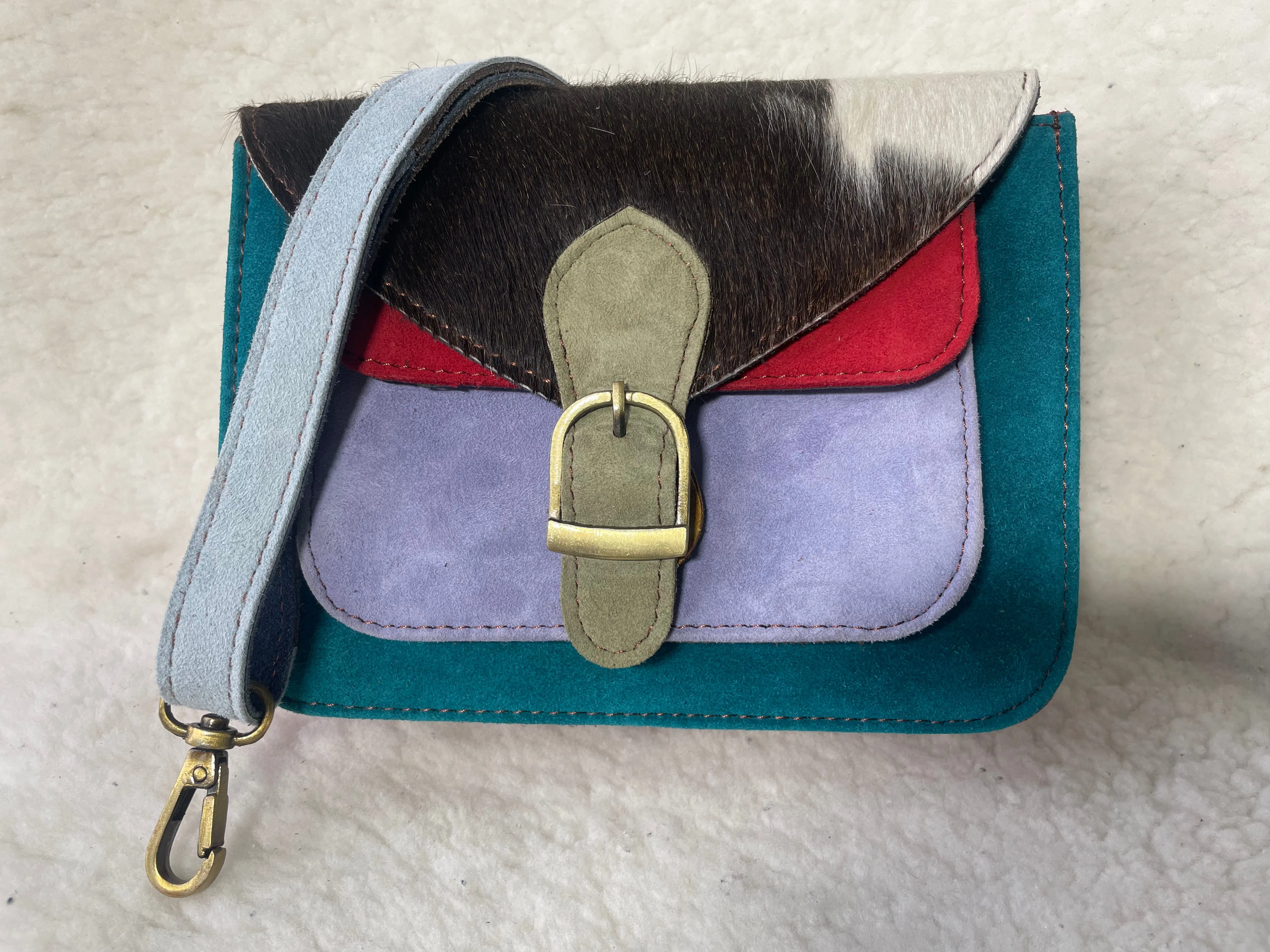 Handcrafted, recycled leather & suede bags.