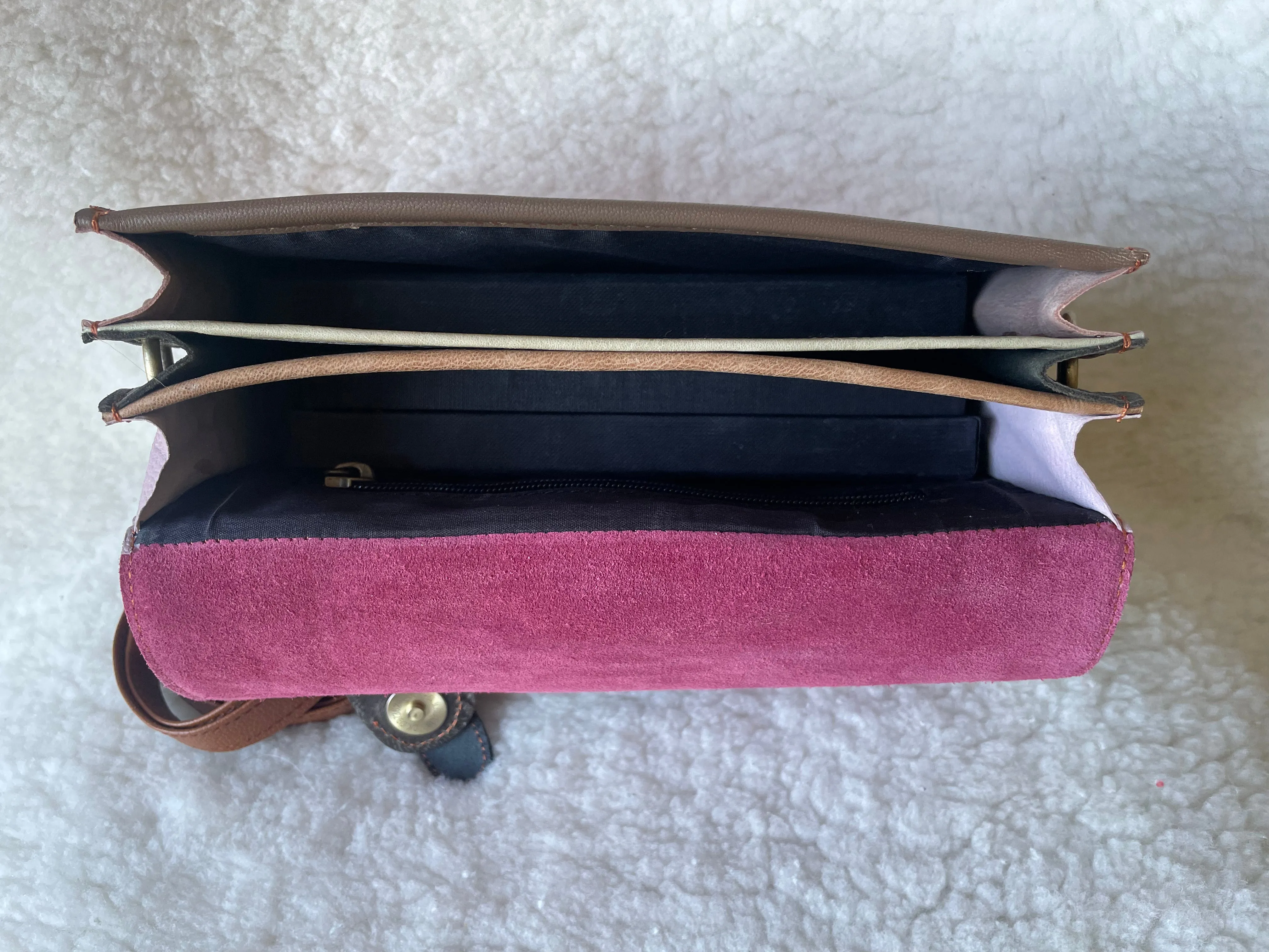 Handcrafted, recycled leather & suede bags.